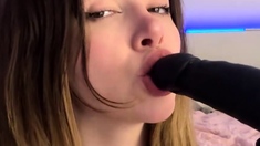 Adrianna Savu deep throats a giant, black fake penis -